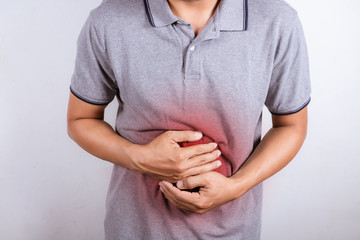 Man having painful stomach ache, enteritis. Healthcare and health insurance concept