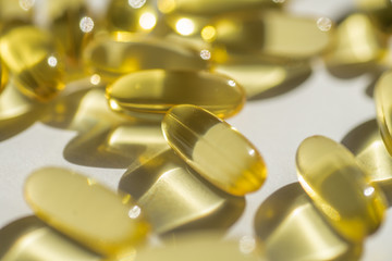 capsules of fish fat oil vitamin for heart, omega 3, macro