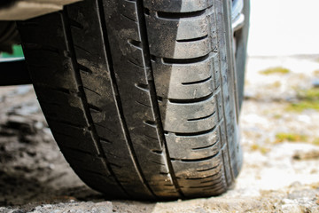 summer car tires in the dust on the ground