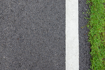 Obraz premium Surface grunge rough asphalt black dark grey road street and green grass texture Background,empty copy space,Top view abstract Seamless tarmac