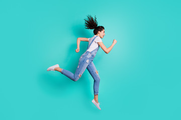 Obraz premium Full length body size view of her she nice attractive sportive purposeful wavy-haired girl jumping running fast marathon achievement isolated on bright vivid shine vibrant green turquoise background