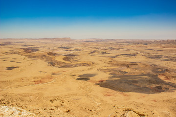 Fototapeta na wymiar aerial top view photography of desert dead land to horizon line empty dry dunes scenery landscape 