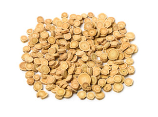 Chinese Herbal medicine - Astragalus slices, Huang Qi (Astragalus propinquus) on white background 
