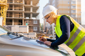 Woman Builder working on a construction site at home