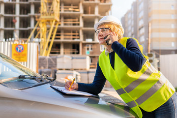 Woman Builder working on a construction site at home