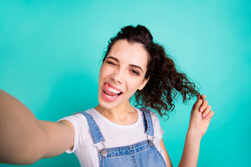 Self-portrait of nice attractive lovely cheerful naughty wavy-haired girl wearing casual showing...