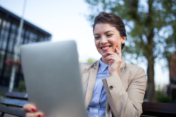 Happy businesswoman using tablet device