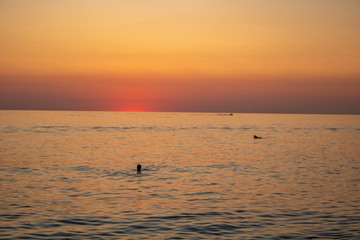 Sunny sunset on a warm and clear sea