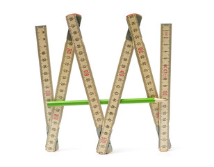 Wooden folding ruler on white background