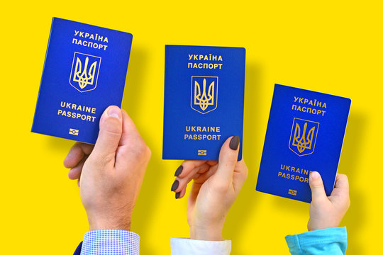 Ukrainian biometric international passports  for the whole family concept - Powered by Adobe