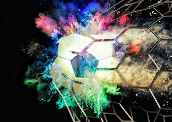 ゴールネットに突き刺さるサッカーボール