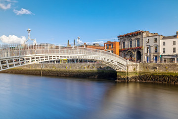 Fototapeta na wymiar Ha'penny Bridge over the Liffey River in Dublin, Ireland