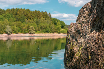 Fototapeta na wymiar rock in lake - landscape in germany nrw wuppertalsperre