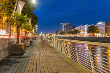 Walkway on the Wellington Quay by the Liffey River in Dublin, Ireland