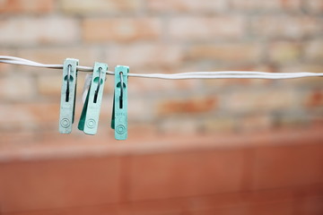 blue clothespins on white wire