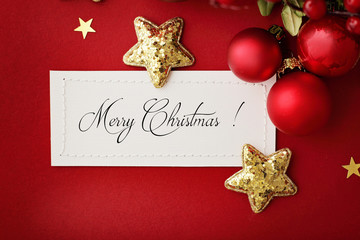 Obraz na płótnie Canvas christmas card with red and gold ornaments