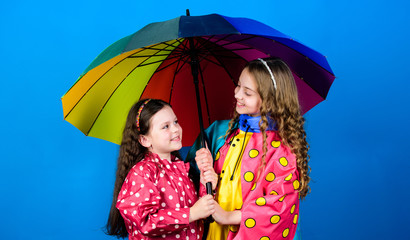 cheerful hipster children, sisterhood. rain protection. Rainbow. happy little girls with colorful umbrella. family bonds. Little girls in raincoat. autumn fashion. Lucky to start the day here