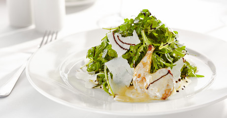 Gourmet, restaurant, delicious dinner food - close up of Salad with Quail Wings and Parmesan Cheese