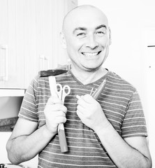 ordinary man posing with hammer in his hands