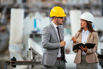 Man and woman discussing work