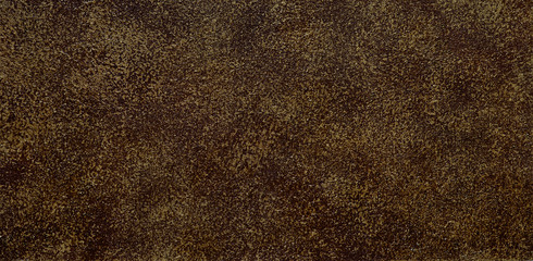 Golden autumnal texture background. Panorama in the form of a spotted texture background in gold, brown, yellow. Wallpaper with a shallow abstract texture.