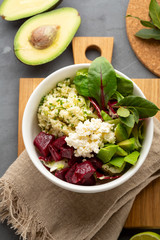 Couscous salad with avocado and feta, healthy bowl