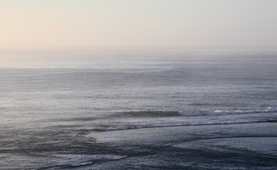 Fototapeta premium Misty morning ocean view in pastel shades