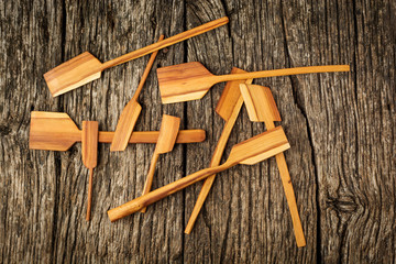 Wooden kitchen utensils on rustic background close-up. Flat lay.