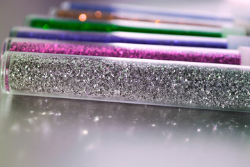 Colored glitter sand in tubes