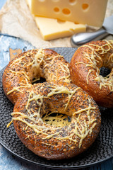 Tasty baked bagels with melted french emmental cheese