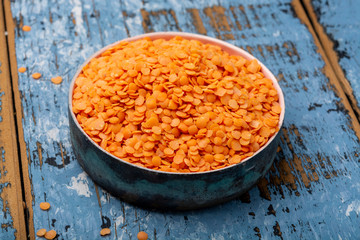 Source of proteins, vegetarian food, red lentils legumes close up