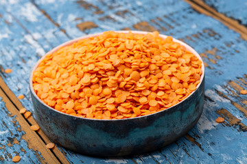 Source of proteins, vegetarian food, red lentils legumes close up