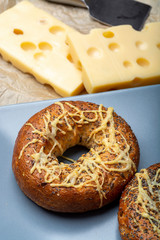 Tasty baked bagels with melted french emmental cheese