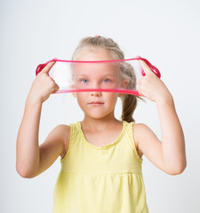 Happy joyful girl playing a red slime
