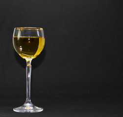 glass of wine on black background