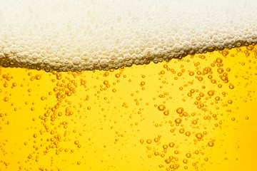 Beer background with bubble froth texture foam pouring alcohol soda in glass happy celebration...
