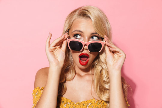 Image closeup of excited blonde woman wearing sunglasses