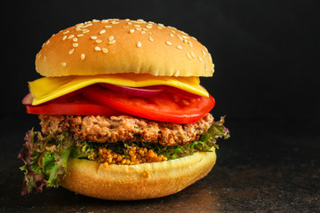 burger (roll, cutlets, cheese, lettuce, tomato, onion, sauce and more) menu concept. food background. copy space. Top view