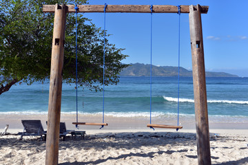 Swings located in the ocean near the island of Gili Meno Island, Indonesia