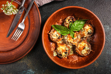 mushroom stuffed cheese (delicious baked vegetable dish, no meat) menu concept. food background. copy space. Top view