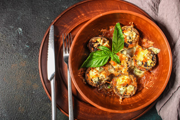 mushroom stuffed cheese (delicious baked vegetable dish, no meat) menu concept. food background. copy space. Top view