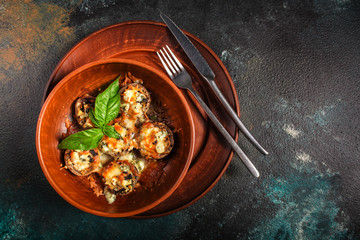 mushroom stuffed cheese (delicious baked vegetable dish, no meat) menu concept. food background. copy space. Top view