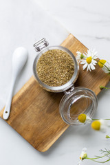 chamomile tea on marble background with copy space. Relax concept