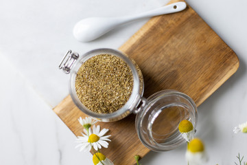 chamomile tea on marble background with copy space. Relax concept