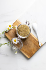 chamomile tea on marble background with copy space. Relax concept