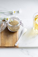 chamomile tea on marble background with copy space. Relax concept