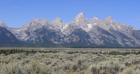 Grand Teton mountain range Wyoming from valley. Mountaineering, hiking, fishing and recreation.  2.5 million visitors a year. Geography, geology, environment, history, landscape