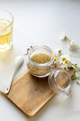 chamomile tea on marble background with copy space. Relax concept