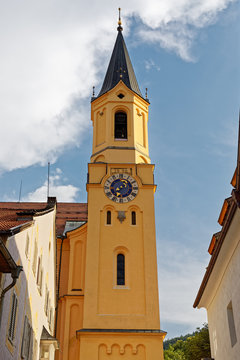 View of one of the clock towers of Parish Church Assumption of St. Mary (Chiesa Di Santa Maria Assunta) Bruneck (Brunico) Trentino-Alto Adige, Italy (vertical photo)