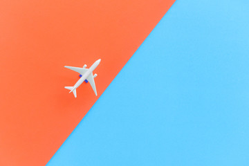 Travel background concept - Airplane Traveler's fly with airliner on blue and orange , top view